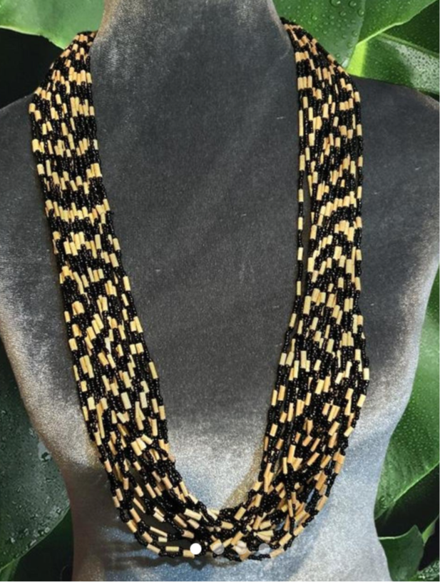 Multiple strands of seed beads and wooden tubes. Vintage