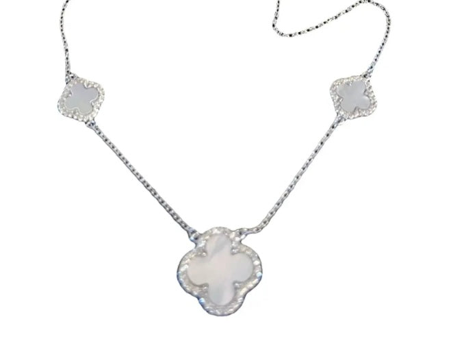Mother of pearl flower pendant in the shape of a four leafed clover, with CZ’s.